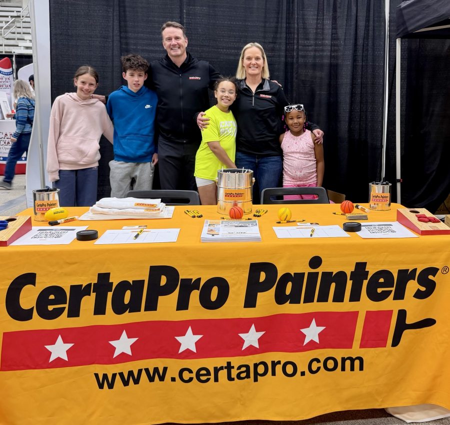 group of adults and children at CertaPro table
