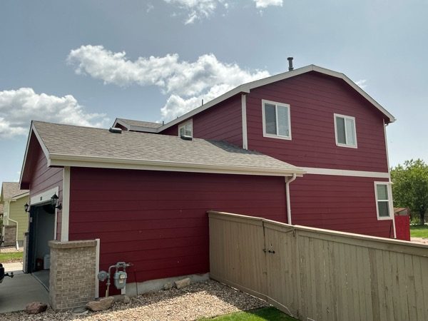 side view and fence against house with red siding Preview Image 4