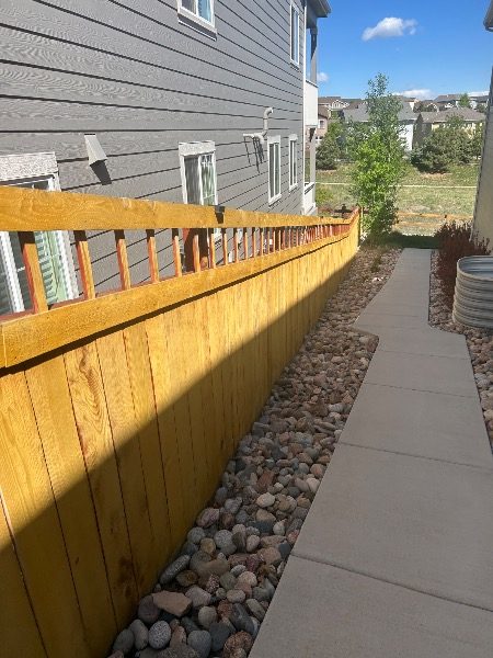 unstained fence surrounding house and yard Preview Image 7
