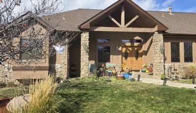 front exterior of stucco home after repaint