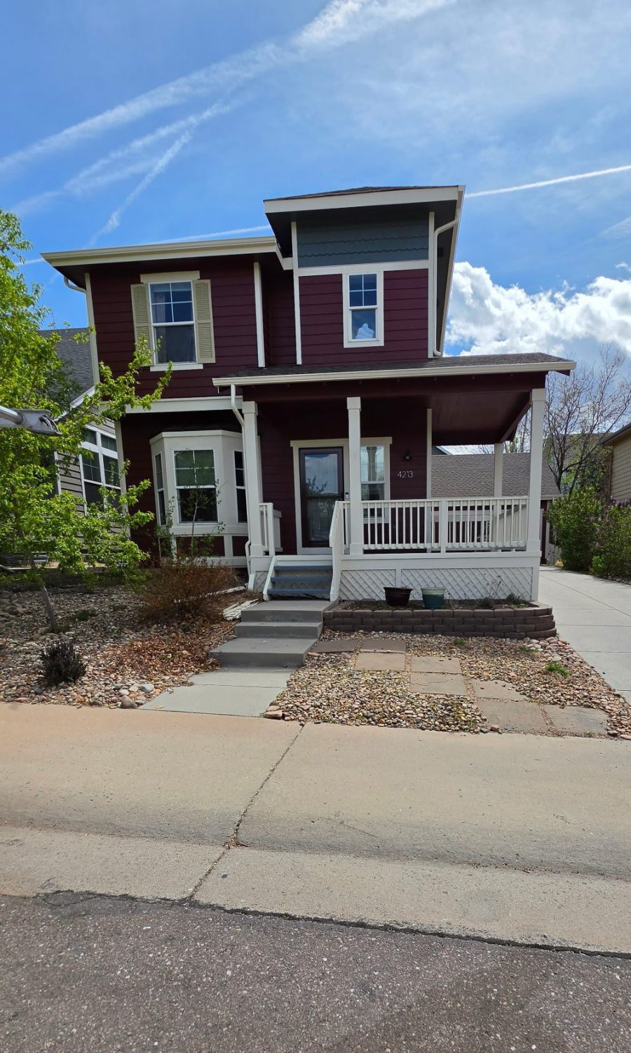 house exterior with marroon siding and white trim Preview Image 1