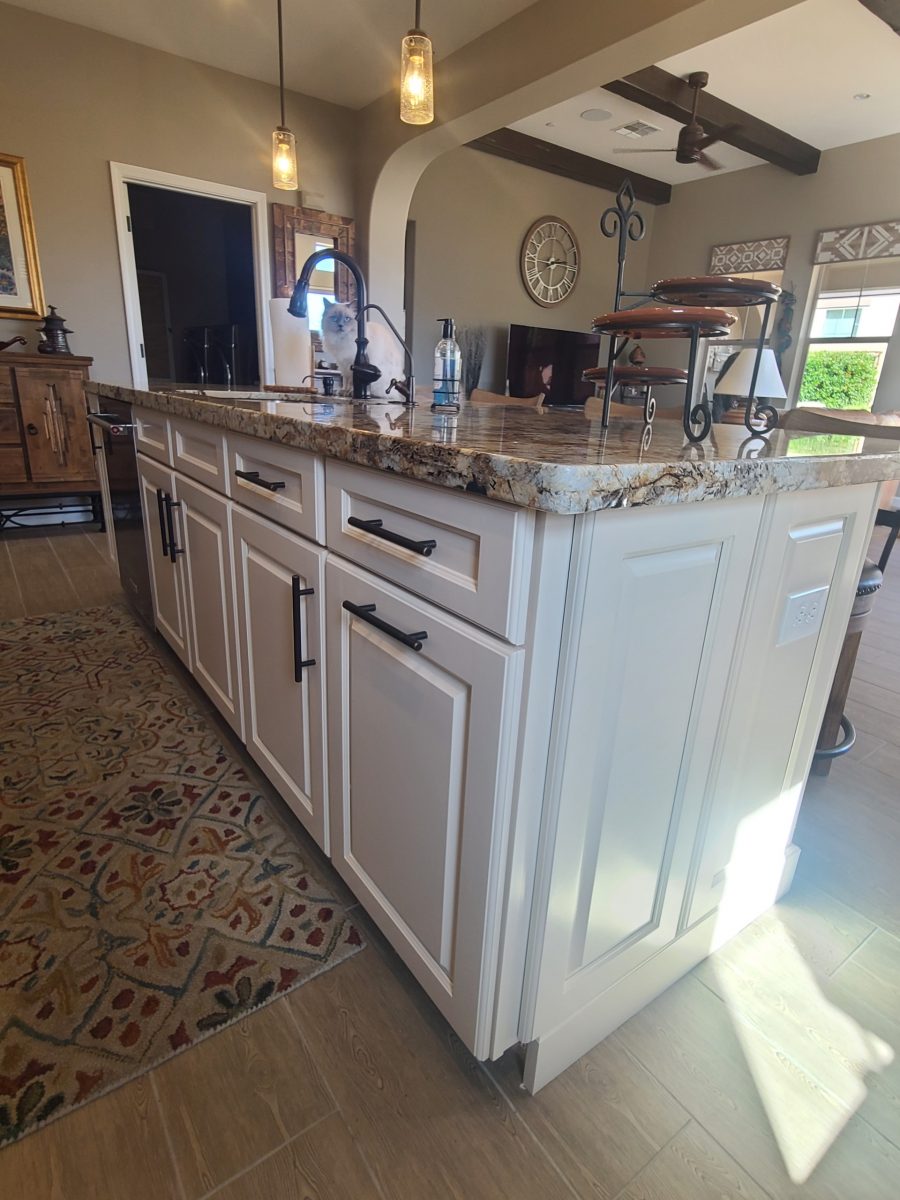 kitchen island with white painted cabinets