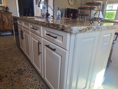 kitchen island with white painted cabinets