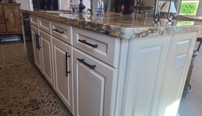 kitchen island with white painted cabinets