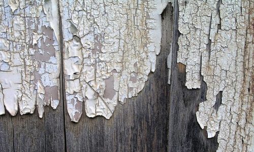 failing paint on fence