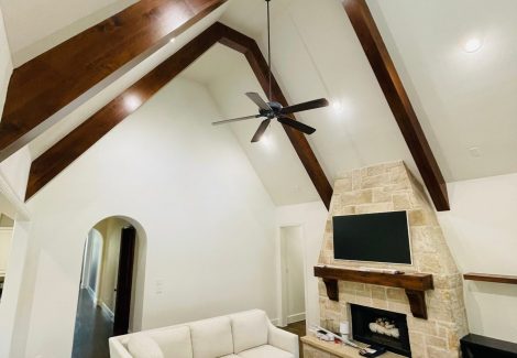 living room with vaulted ceiling and fireplace