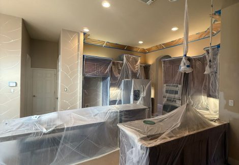 kitchen with protective coverings for painting