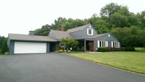 Gray Home with White Trim and White Garage Door