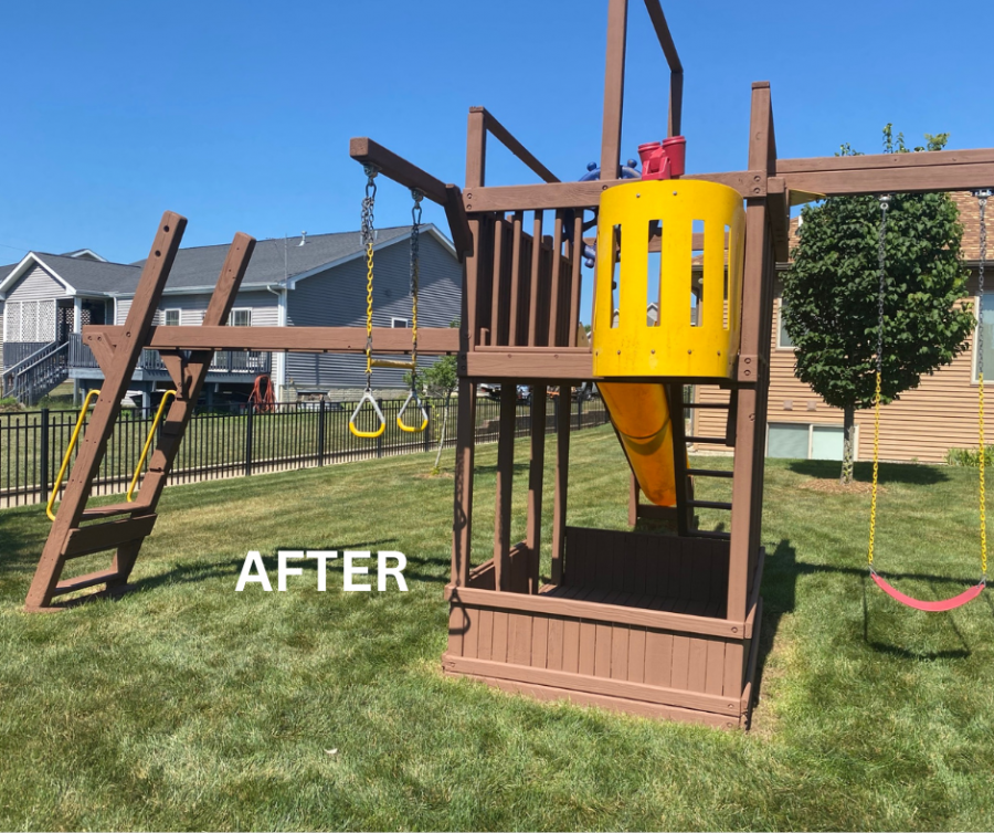 stained wooden playset in grass behind house Preview Image 2