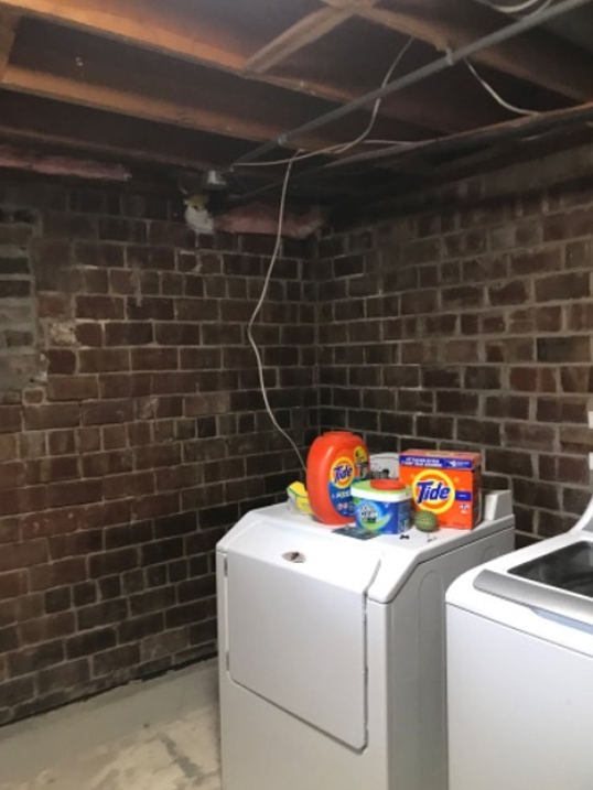 washer and dryer in brick-walled room Preview Image 5
