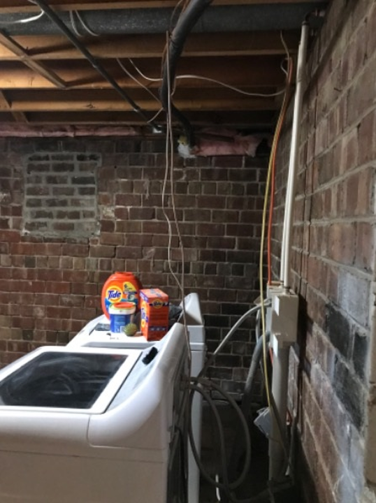 washer and dryer in brick-walled room Preview Image 6