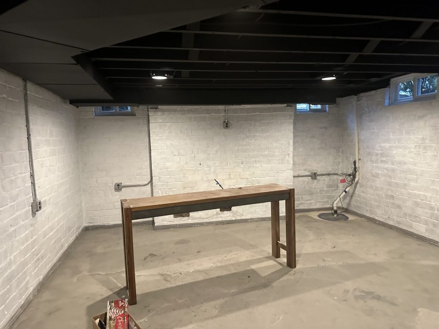 basement room with whitewashed brick wall and table Preview Image 2