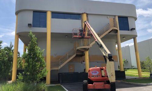 Using a Crane to Paint the Exterior