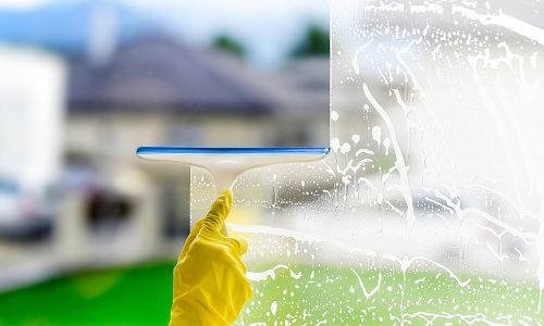 cleaning windows with wiper