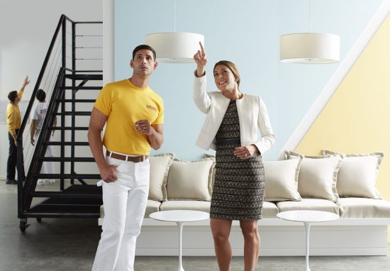 Women Pointing at wall with Certapro Painter