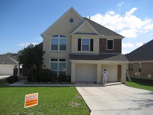 Exterior painting by CertaPro house painters in Stone Oak, TX