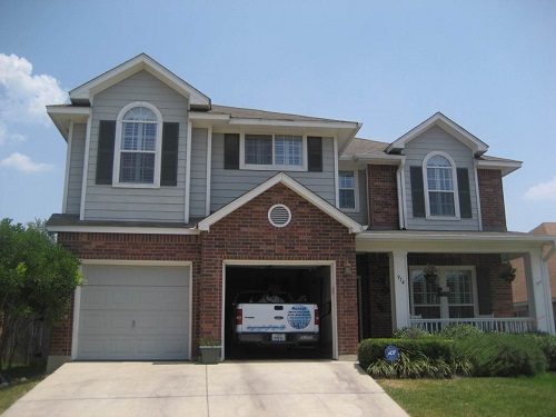 Exterior house painting by CertaPro painters in Stone Oak, TX