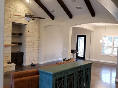 white painted room with rafters