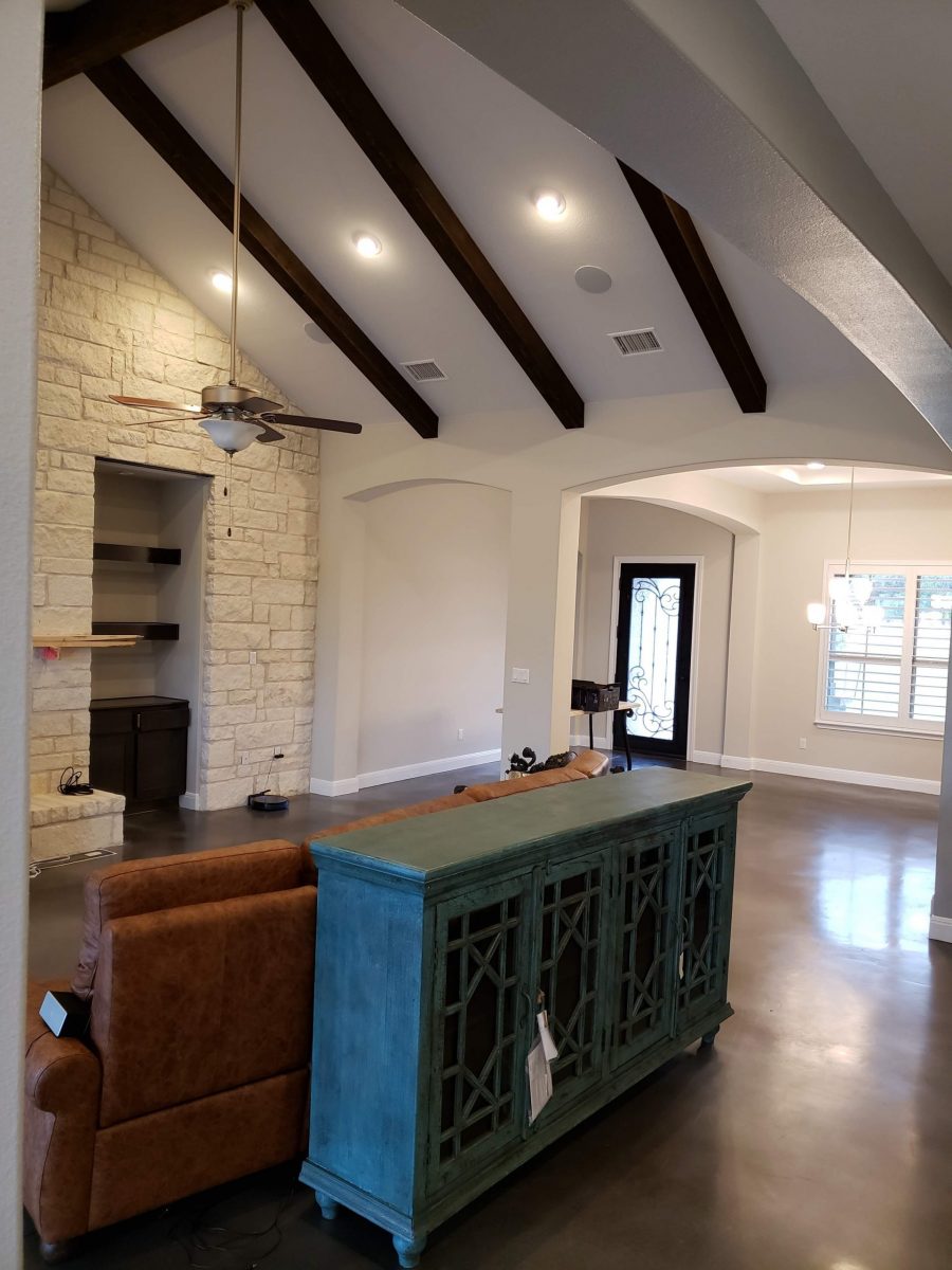 living room with vaulted ceilings and exposed beams Preview Image 6