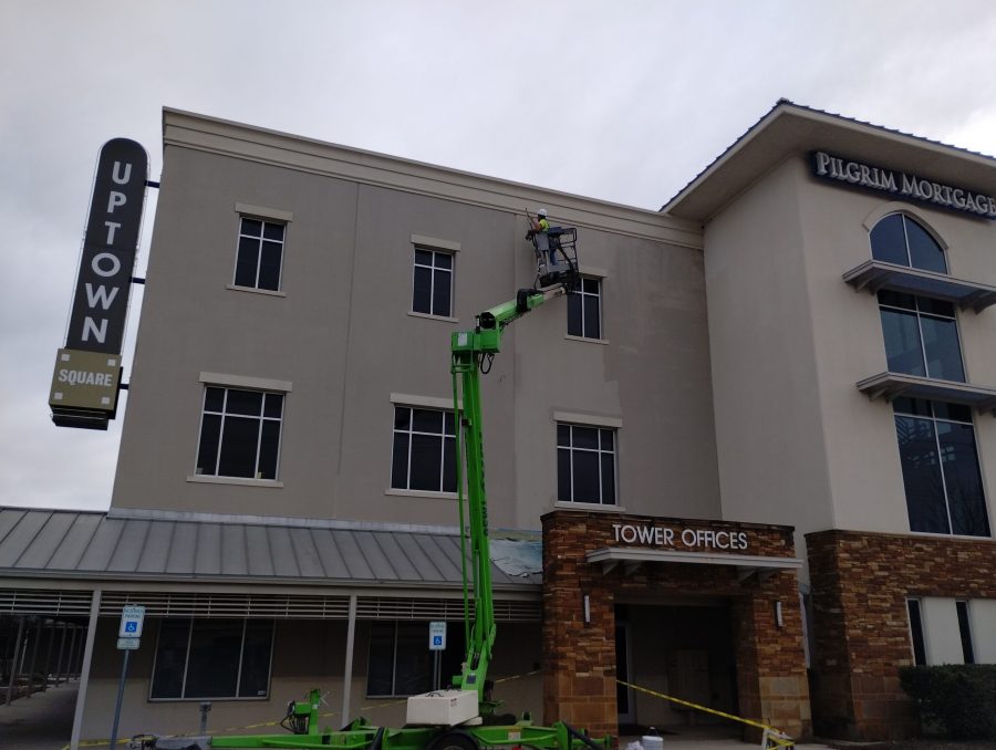 painter in boom lift working on building exterior Preview Image 2