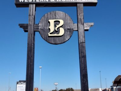 retail sign with black painted posts