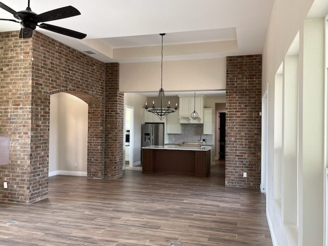 empty home living area with exposed brick wall Preview Image 4