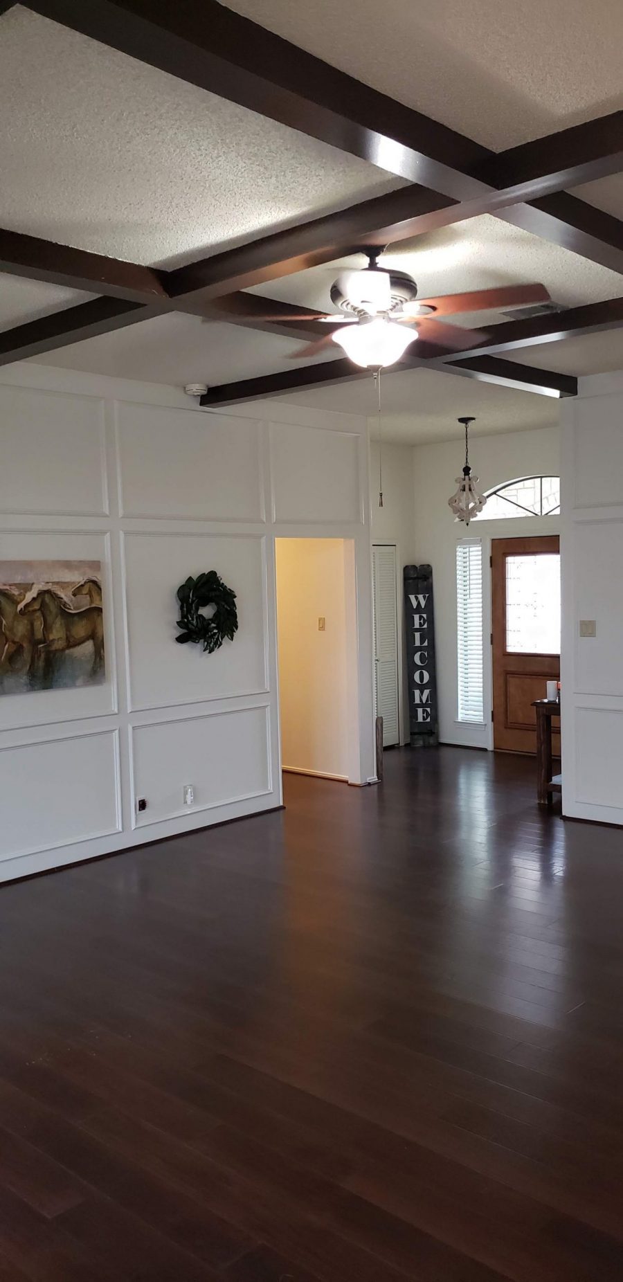 living room painted white with exposed wood beams Preview Image 3