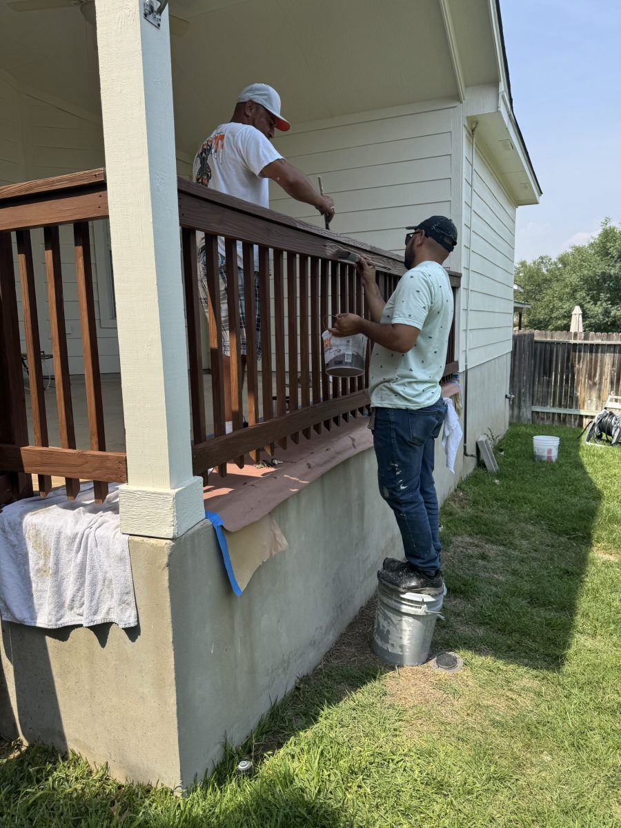 two painters staining wooden deck rails Preview Image 2
