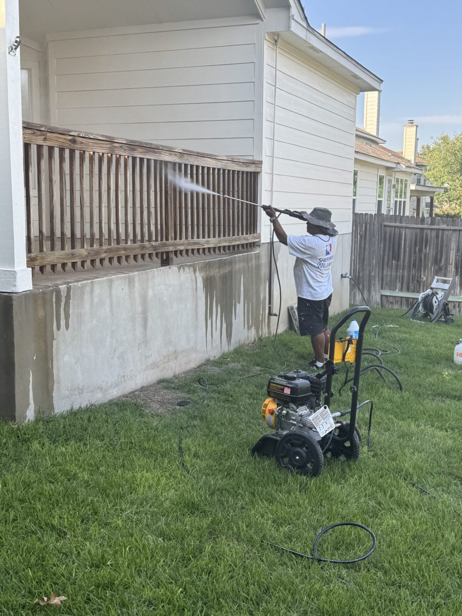 person power washing wooden deck rails Preview Image 3