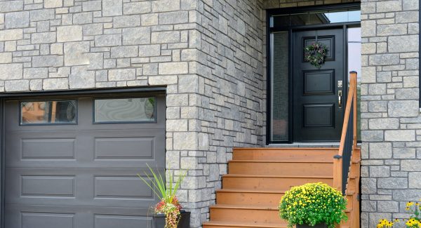 brick entrance door and wood stairs