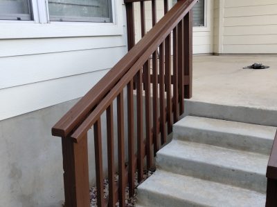 stained wooden deck rails