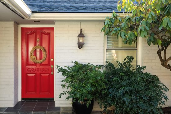 red door and white brick