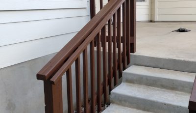 stained wooden deck rails