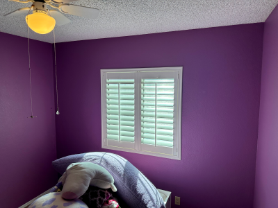 purple wall with window in bedroom