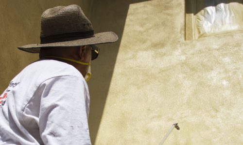 painter painting stucco