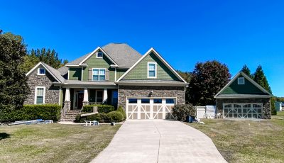 large home with a long driveway after exterior painting