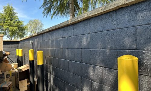 Safety Poles Near Dumpster