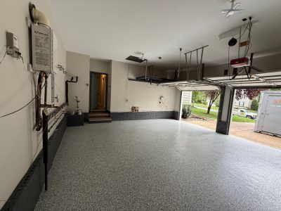home garage with polyaspartic coated floor and painted walls