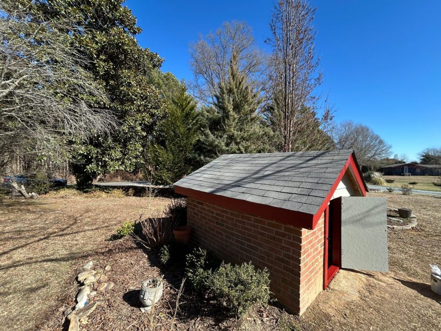 brick well house with red painted trim Preview Image 1