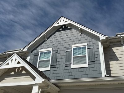 painted house exterior with dark and beige two tone