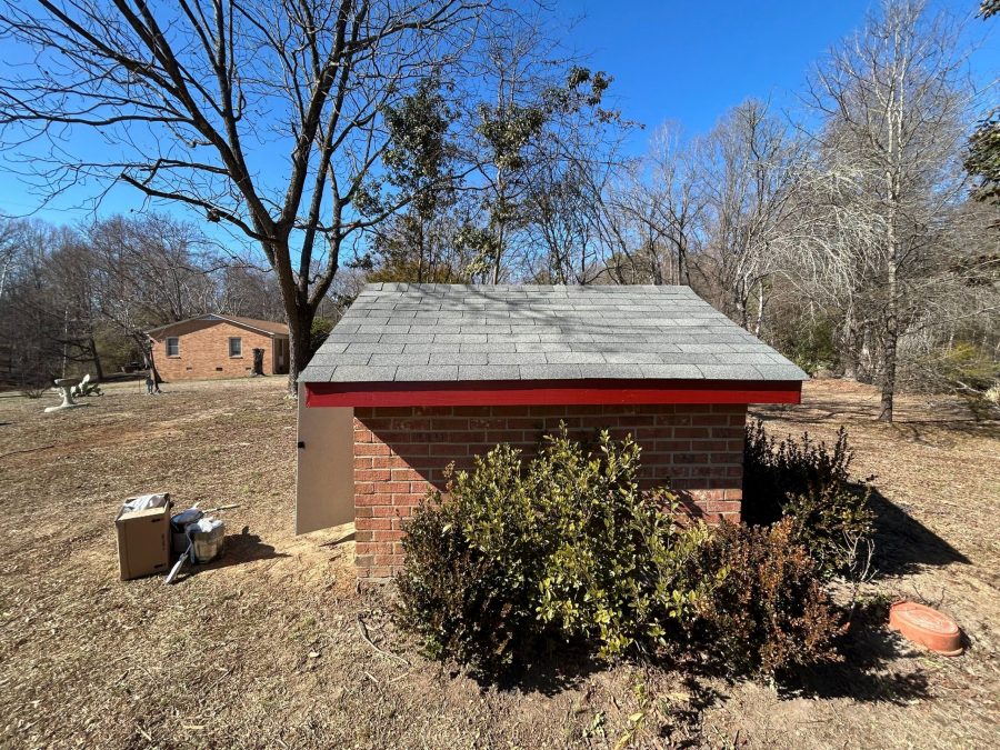 brick well house with red painted trim Preview Image 2