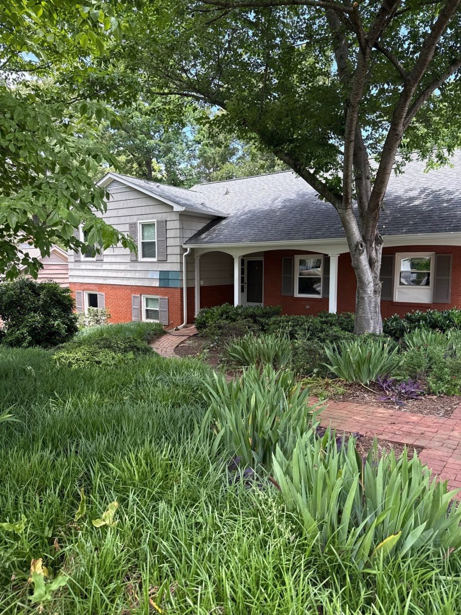 split level house with brick and worn neutral siding Preview Image 1