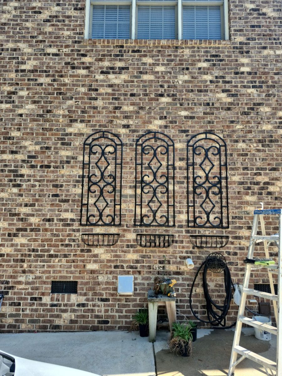 black painted decorative metal accents on brick exterior wall Preview Image 4