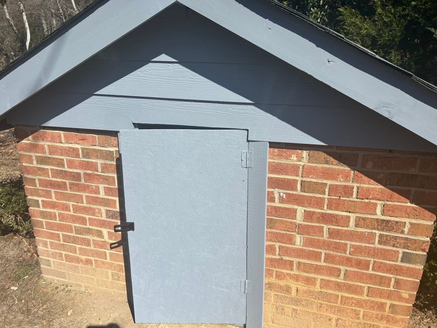 brick well house with grey blue door and trim Preview Image 4