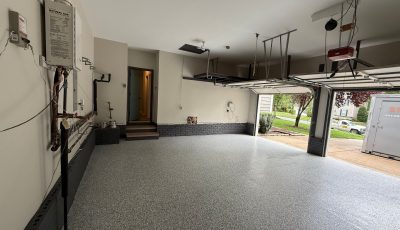 home garage with polyaspartic coated floor and painted walls