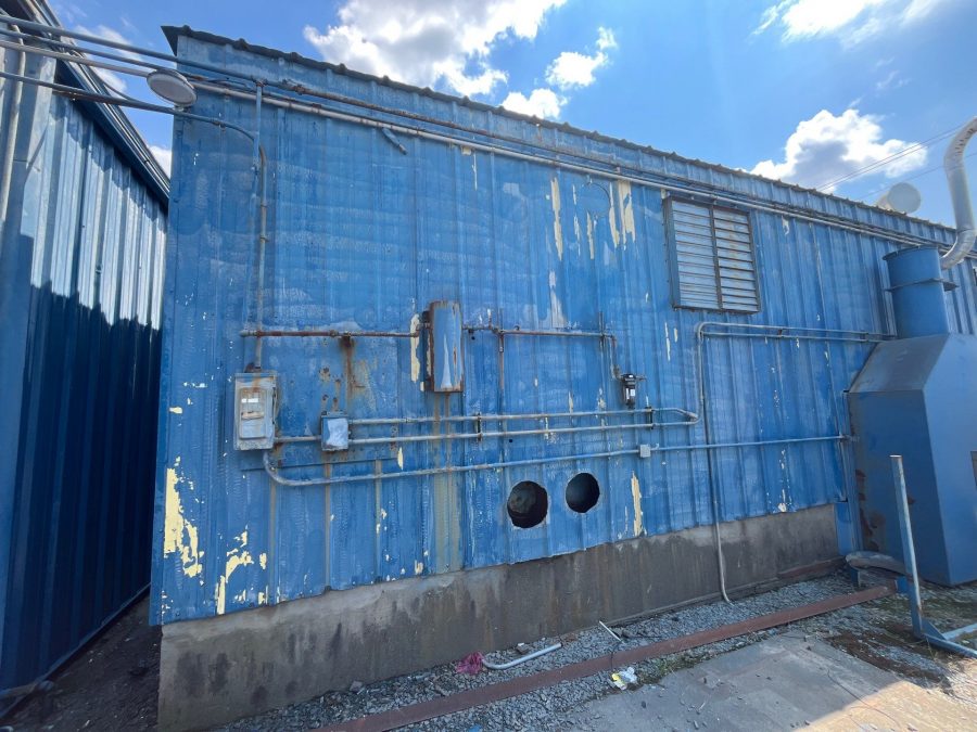 industrial facility with chipped and faded blue paint Preview Image 6