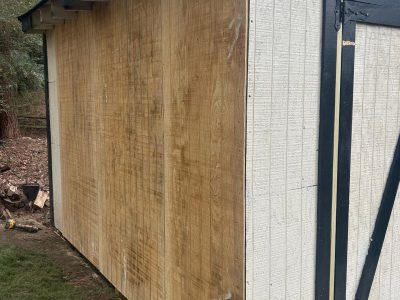 wooden shed with side wall installed