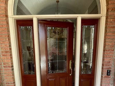 re-stained wooden home entryway door