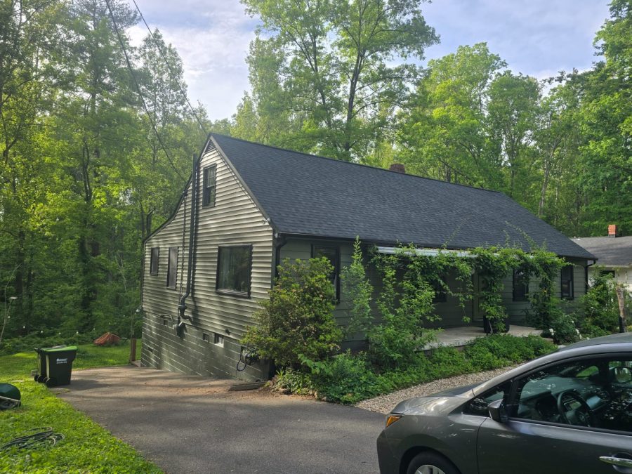 front corner view of driveway, and house with painted siding and brick Preview Image 1
