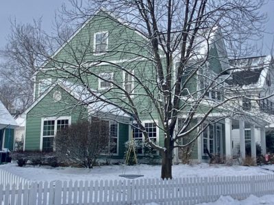 home wiht blue siding in the winter in charlottesville